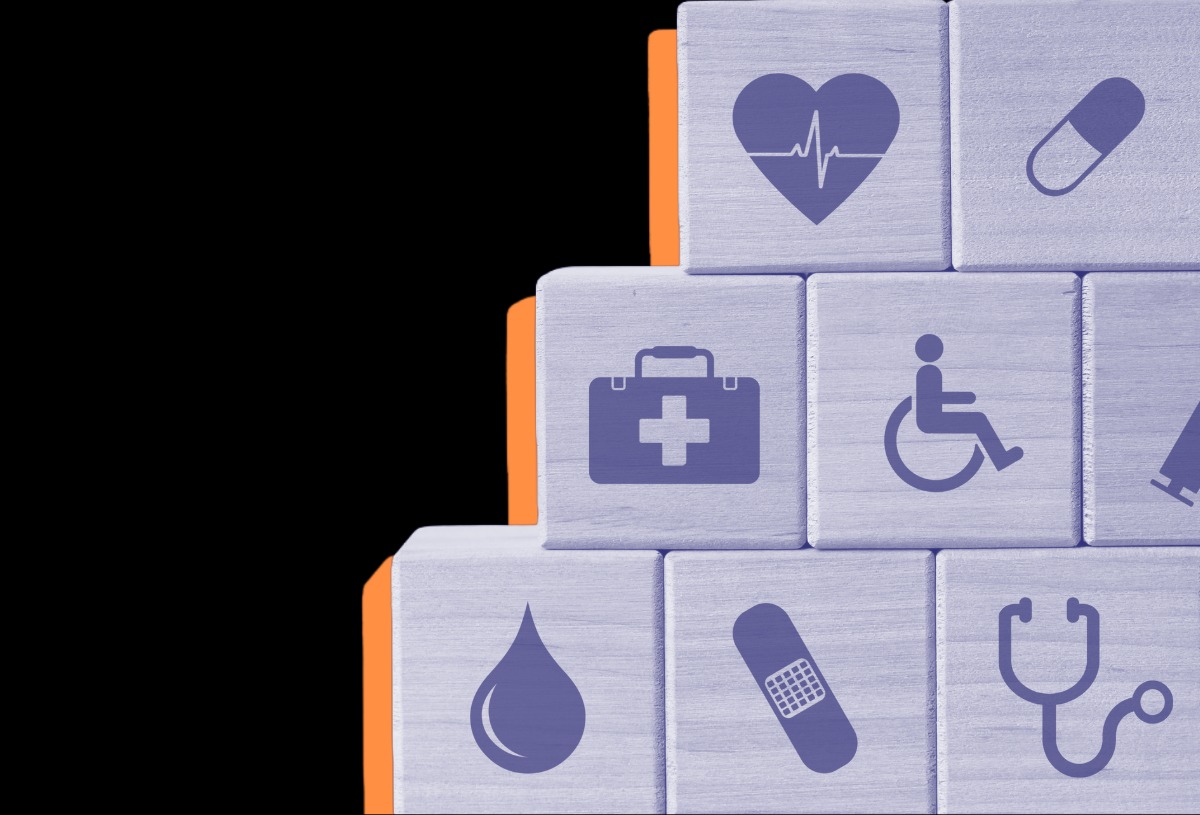 Illustration of stacked wooden blocks featuring healthcare icons, including a heart monitor, medicine capsule, first aid kit, wheelchair symbol, blood drop, bandage and stethoscope, arranged against a black background with orange accents.